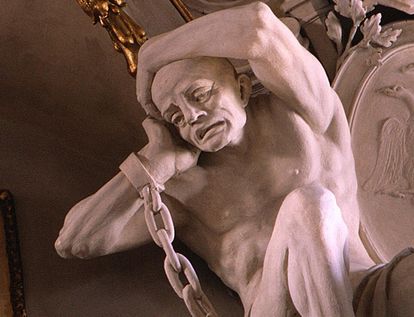 Stucco figure of a captive Turk in chains on the wall in the ancestral hall