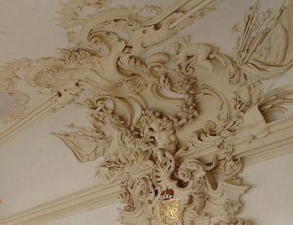 Stucco detail from above the door to the ancestral hall