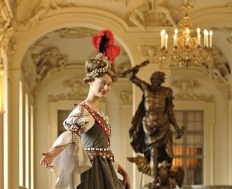 Costumed tour guide on the staircase, Rastatt Residential Palace